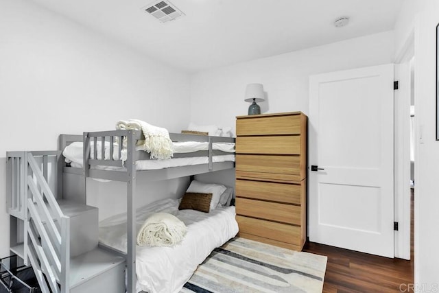 bedroom featuring dark hardwood / wood-style flooring