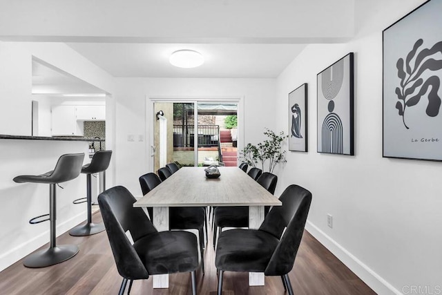 dining space with dark hardwood / wood-style floors