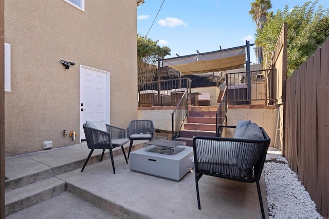 view of patio with a fire pit