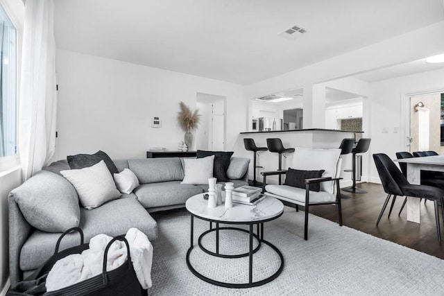 living room featuring hardwood / wood-style flooring and plenty of natural light