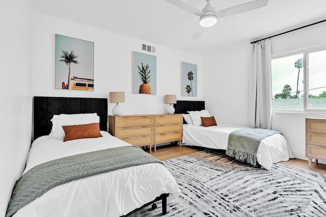 bedroom featuring hardwood / wood-style floors and ceiling fan