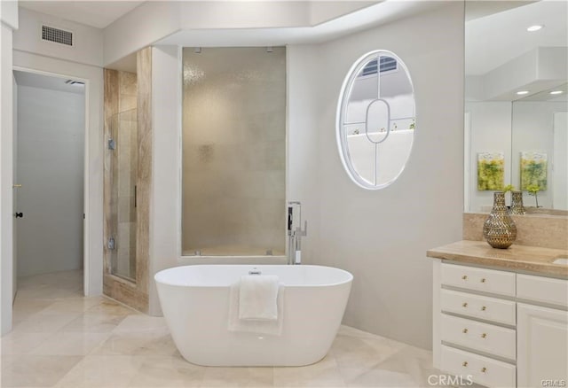 bathroom with vanity and plus walk in shower