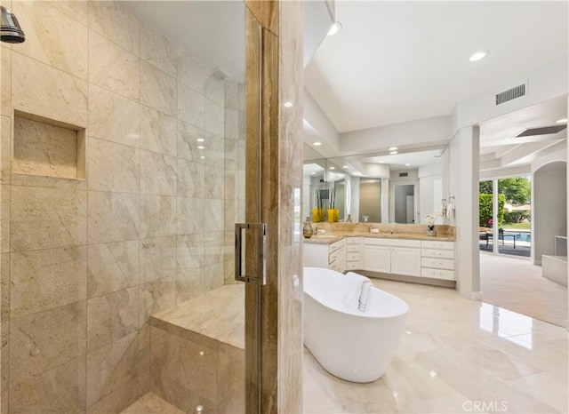 bathroom with plus walk in shower and vanity