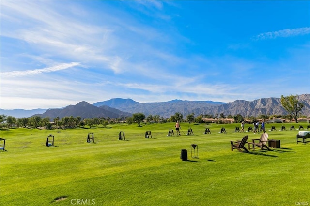 view of community featuring a yard and a mountain view