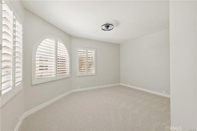 empty room featuring light colored carpet