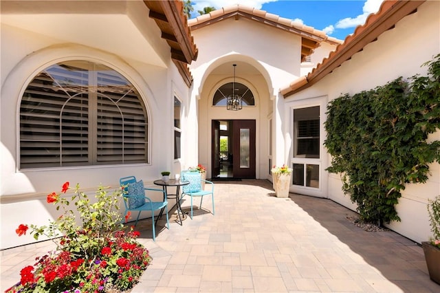 doorway to property with a patio