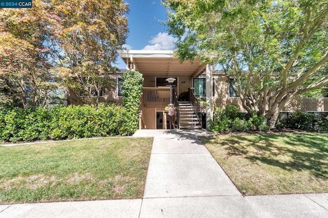 view of front of home with a front yard