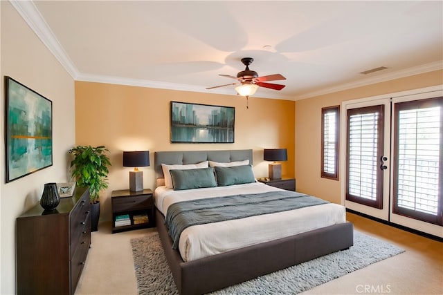 carpeted bedroom featuring ceiling fan, ornamental molding, and access to outside