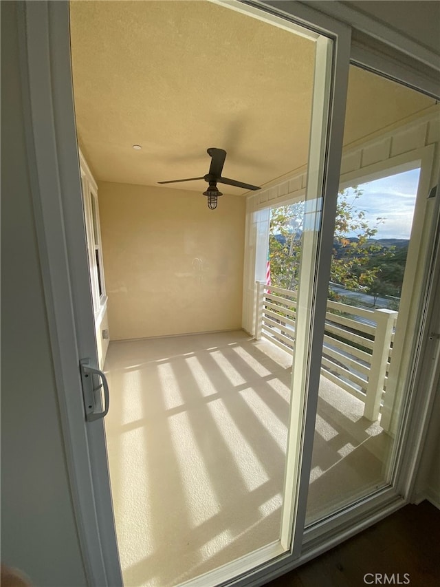 interior space featuring ceiling fan