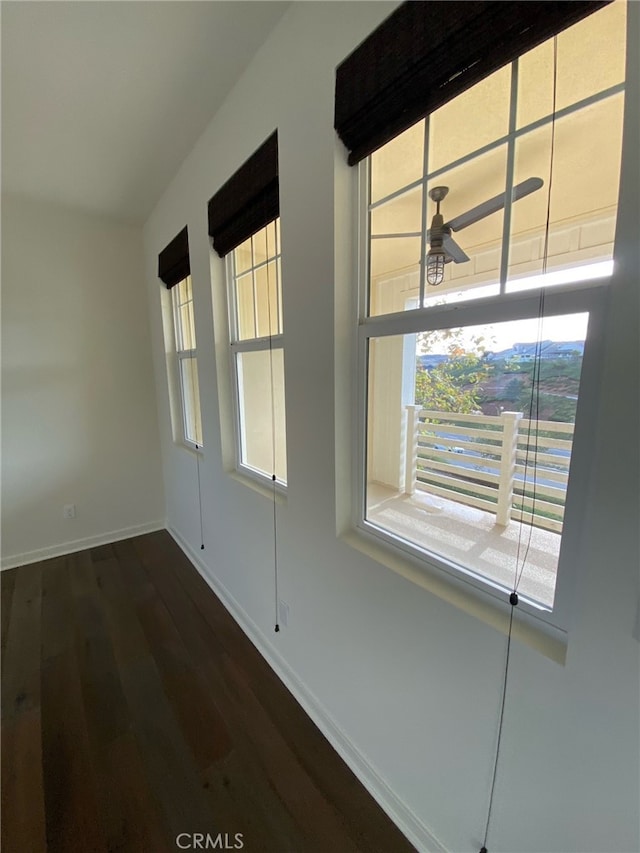 spare room featuring dark hardwood / wood-style flooring