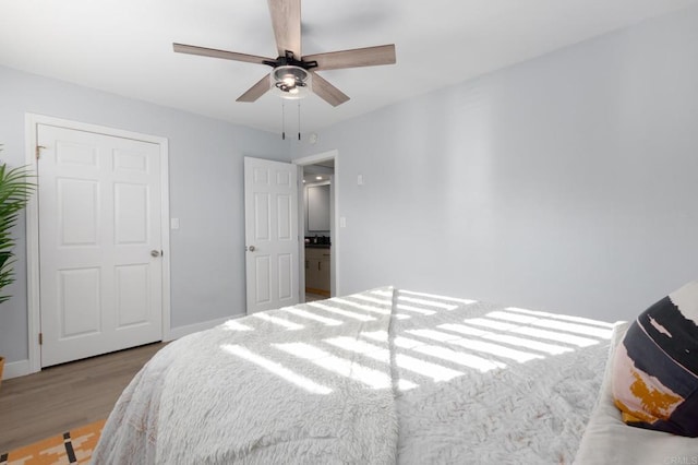 bedroom with ceiling fan and light hardwood / wood-style floors