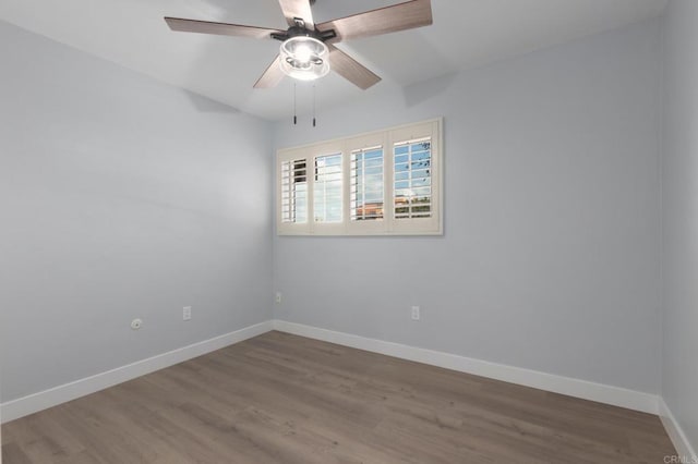 spare room featuring ceiling fan and hardwood / wood-style flooring