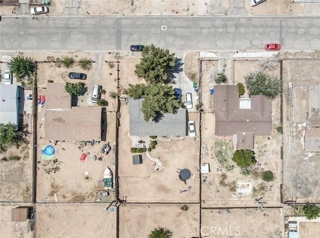 birds eye view of property with view of desert