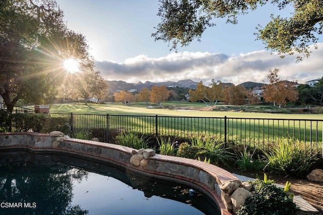 view of swimming pool featuring a mountain view