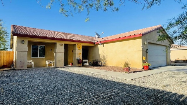 back of house featuring a garage