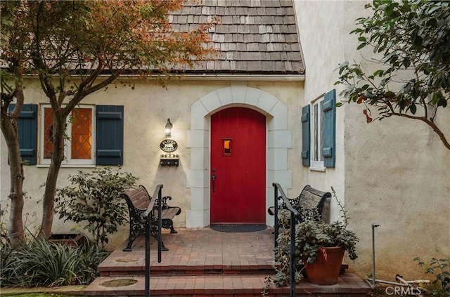 property entrance with a patio