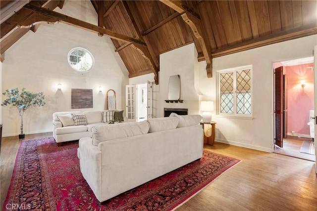 living room featuring wood ceiling, beam ceiling, high vaulted ceiling, and hardwood / wood-style floors