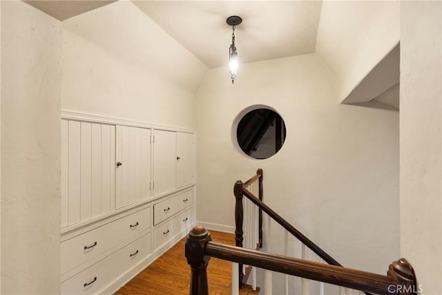 interior space with vaulted ceiling and wood-type flooring