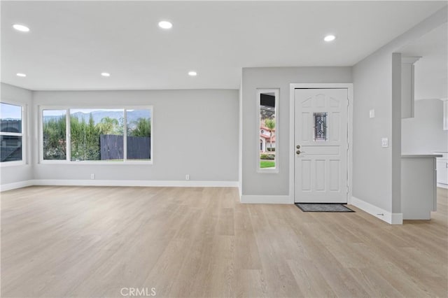 entrance foyer featuring light wood-type flooring