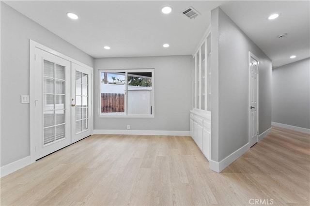 interior space featuring light hardwood / wood-style floors and french doors