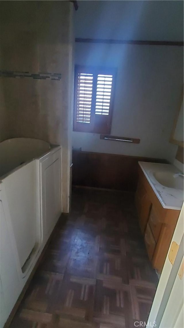 bathroom with vanity and parquet floors