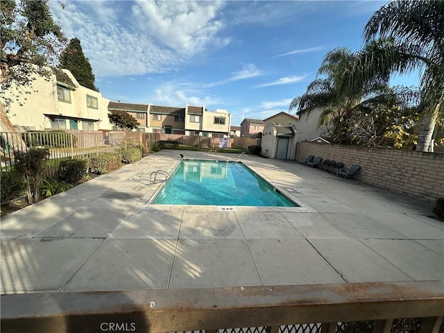 view of swimming pool with a patio