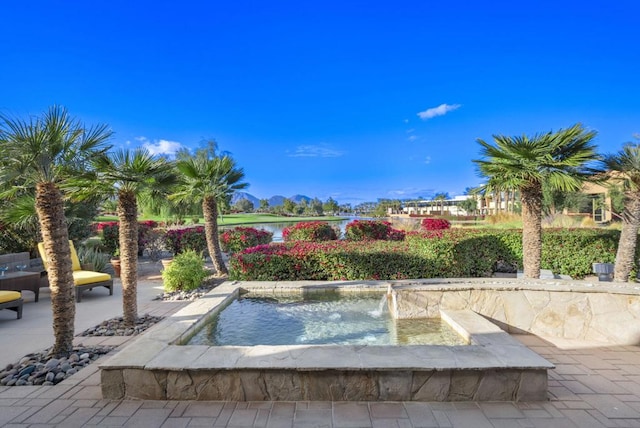 view of swimming pool featuring pool water feature