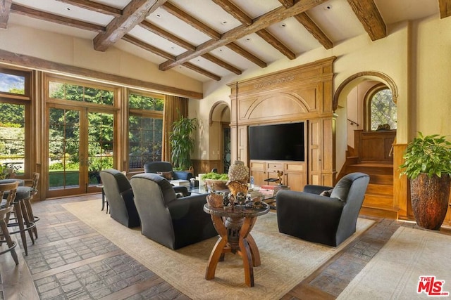 living room with french doors, high vaulted ceiling, and beamed ceiling