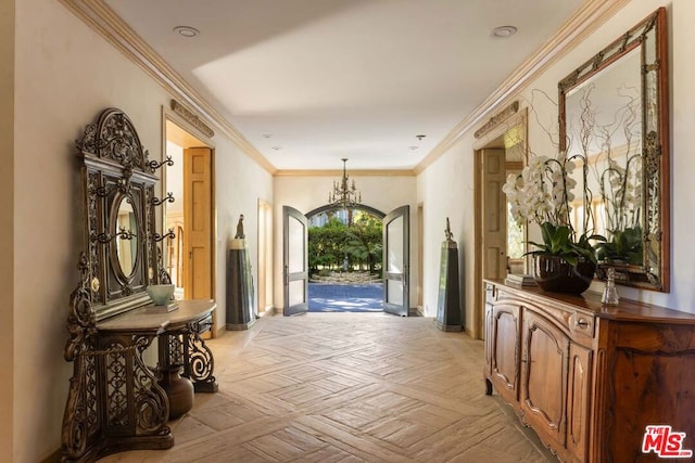 corridor featuring ornamental molding, light parquet flooring, and a chandelier