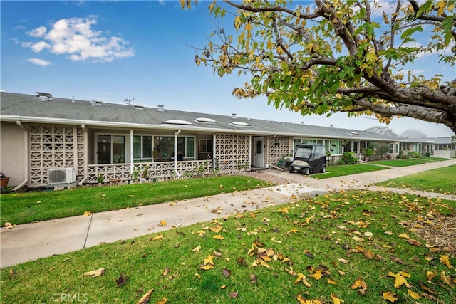 ranch-style house with a front lawn