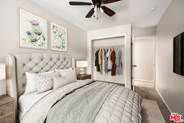 carpeted bedroom featuring ceiling fan and a closet