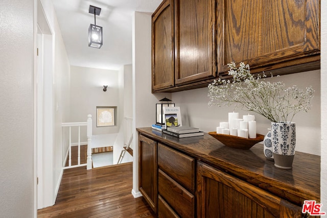 hall with dark hardwood / wood-style floors