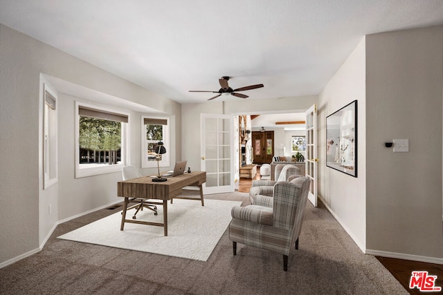 office space with ceiling fan, french doors, and dark carpet