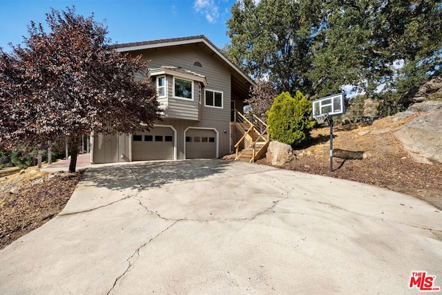 view of property exterior featuring a garage