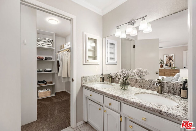 bathroom featuring vanity and crown molding