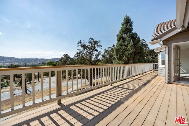 wooden terrace with a mountain view