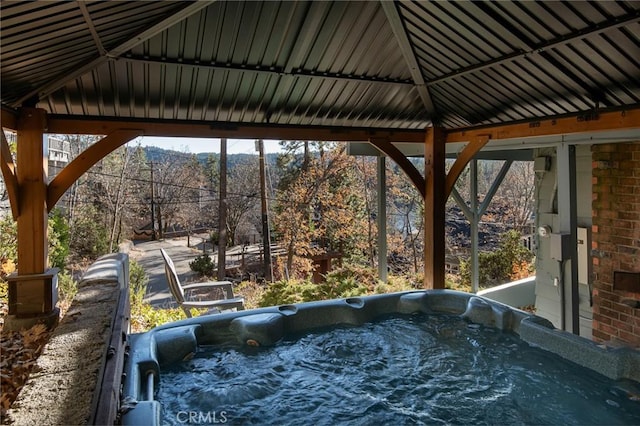 exterior space featuring a hot tub