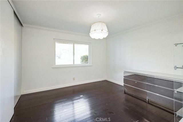 unfurnished room with crown molding and dark hardwood / wood-style floors