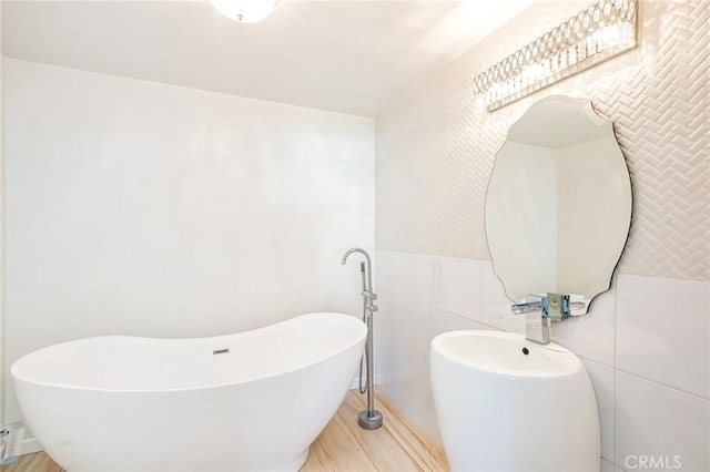 bathroom featuring tile walls and a bathing tub