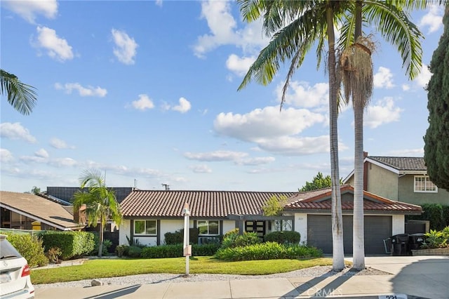 ranch-style house with a front lawn and a garage