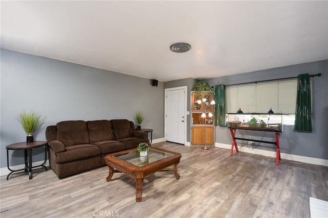 living room with light hardwood / wood-style flooring