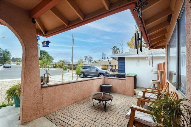 view of patio / terrace with a fire pit