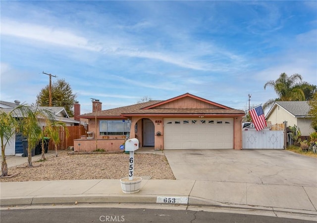 ranch-style home featuring a garage