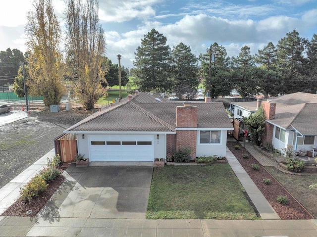 ranch-style home featuring a garage