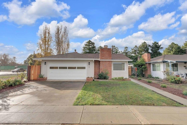 view of front of property with a garage and a front yard