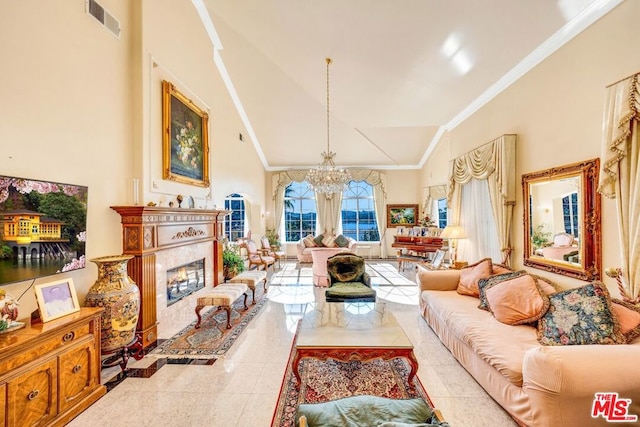 tiled living room with a fireplace, ornamental molding, high vaulted ceiling, and a notable chandelier