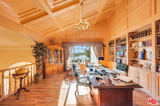 office featuring coffered ceiling, built in shelves, crown molding, light hardwood / wood-style flooring, and a chandelier