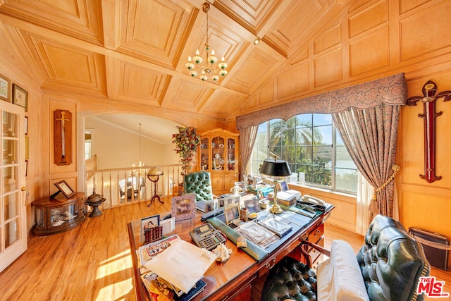 office area featuring wood walls, light hardwood / wood-style floors, coffered ceiling, and ornamental molding