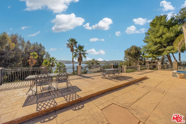 view of patio / terrace featuring a water view