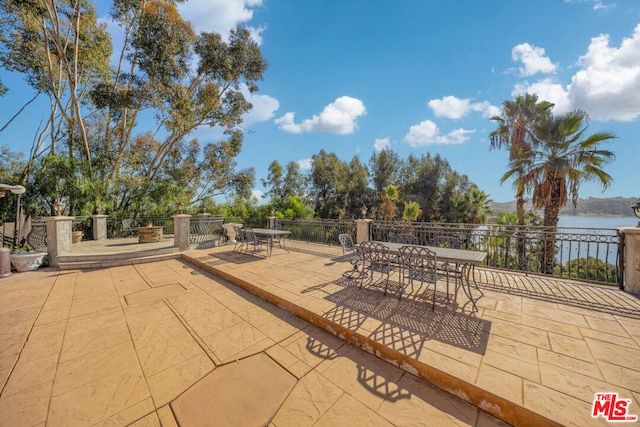 view of patio / terrace featuring a water view